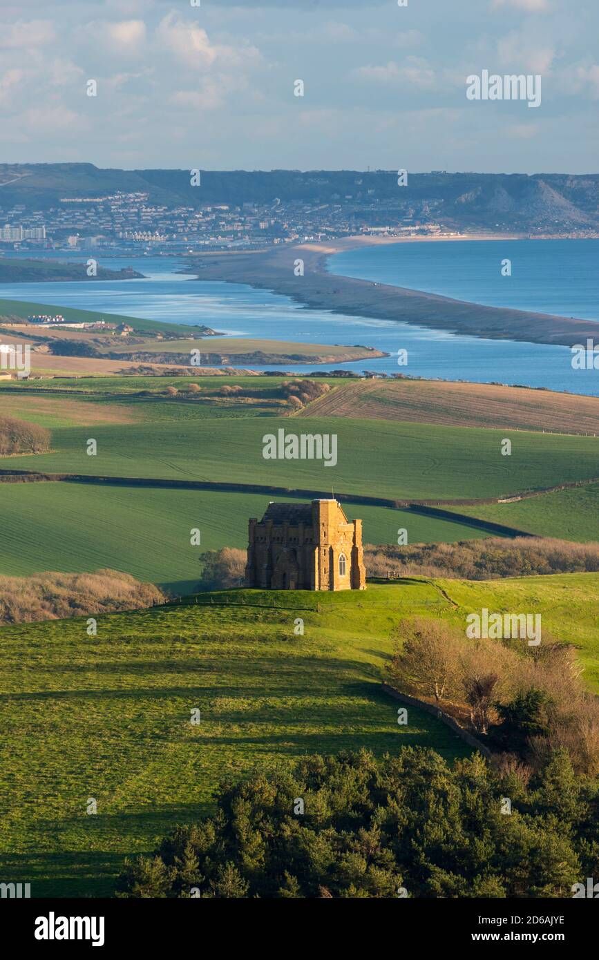 Abbotsbury, Dorset, UK.  15th October 2020.  UK Weather.  View of St Catherine’s Chapel at Abbotsbury in Dorset with the Fleet lagoon and Isle of Portland in the distance on an afternoon of warm autumn sunshine.  Picture Credit: Graham Hunt/Alamy Live News Stock Photo