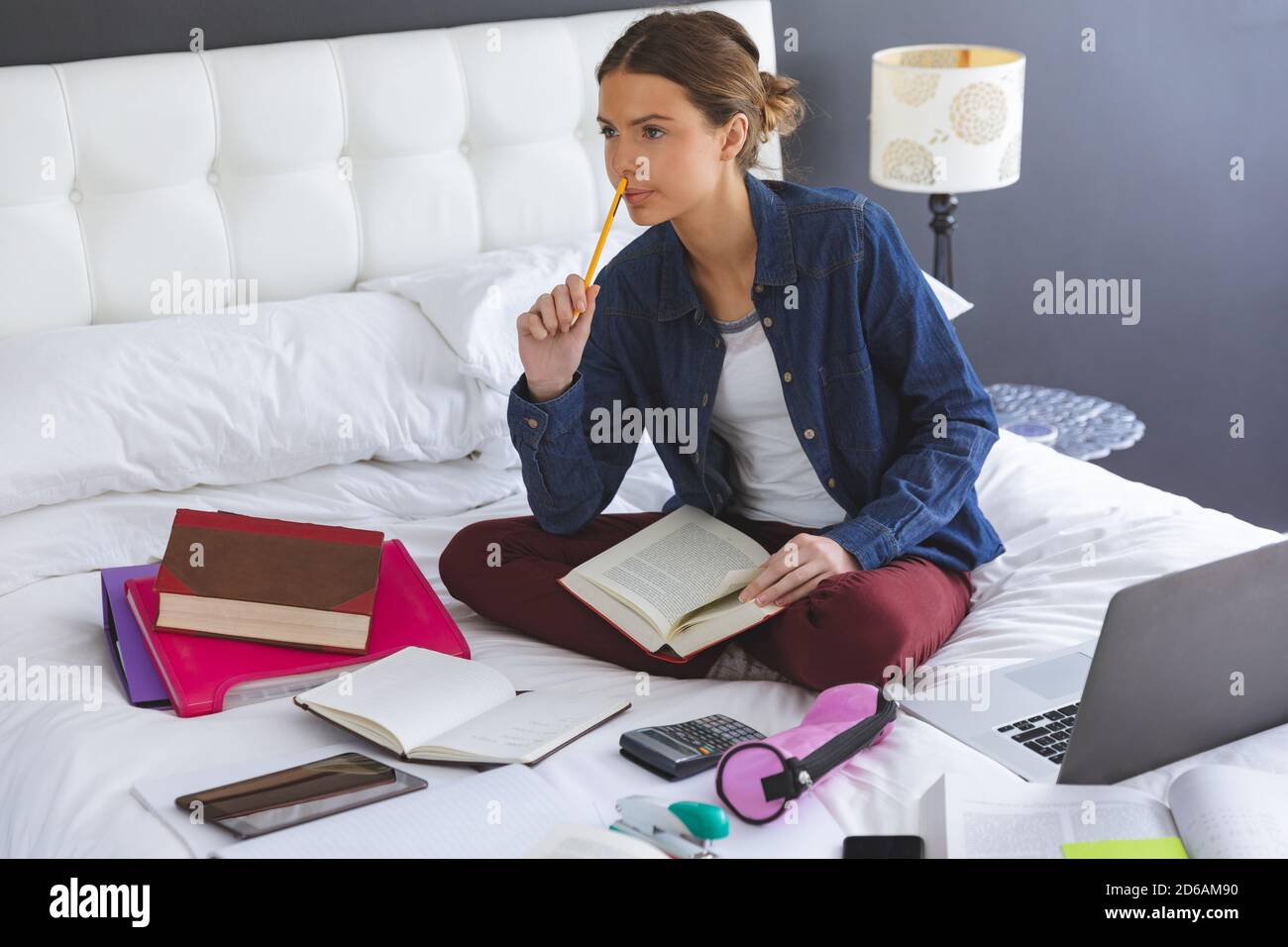 Woman holding pencil on hi-res stock photography and images - Alamy