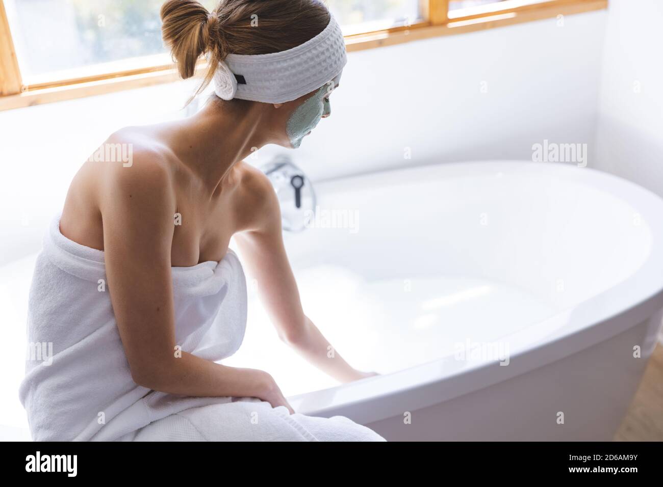 Woman In Towel Sitting Edge High Resolution Stock Photography And Images Alamy
