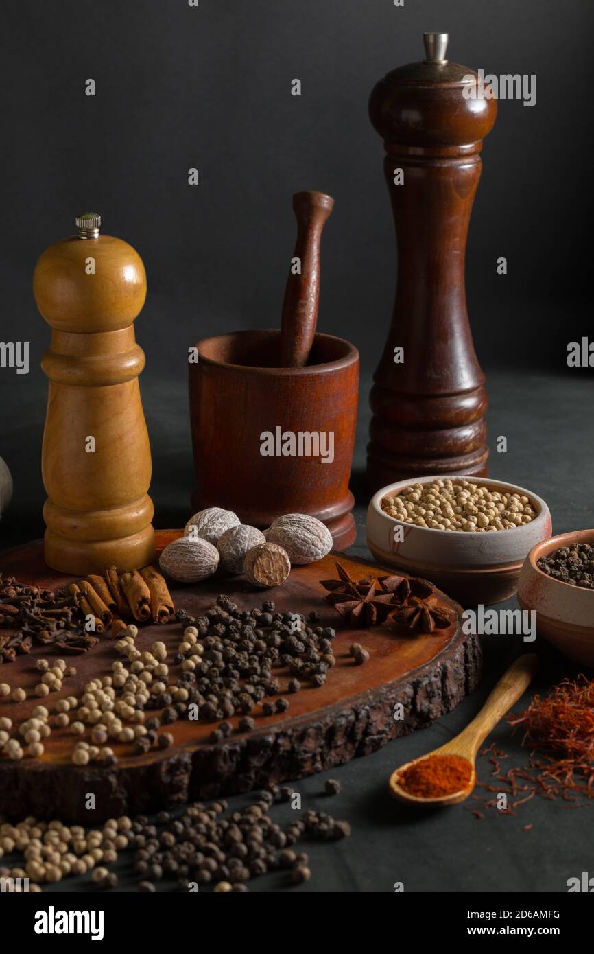 Still life with different kind of spices like pepper, nutmeg, cinnamon