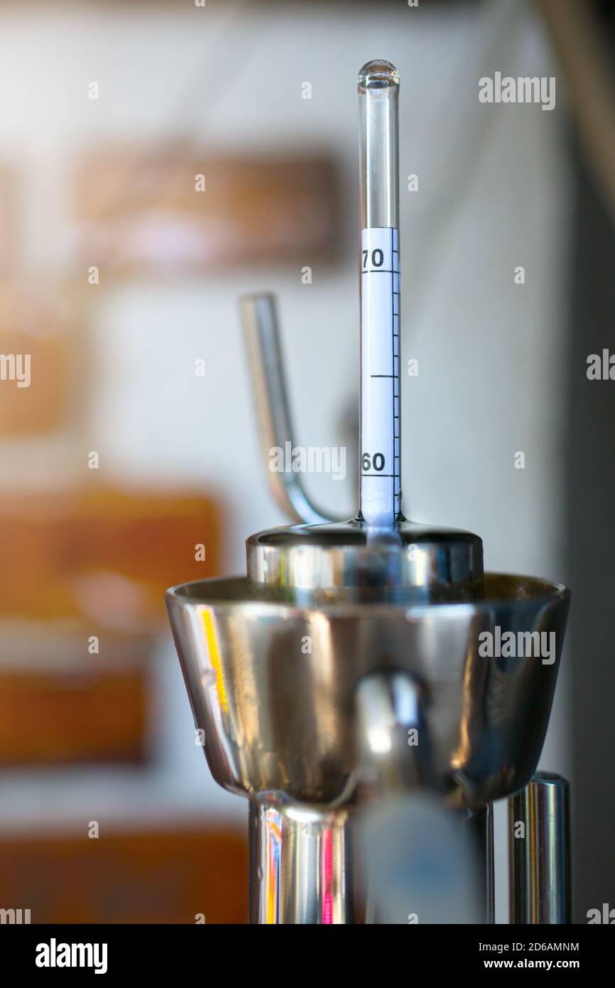 homemade moonshine winemaking; Alcoholmeter in Hydrometer Jar, test