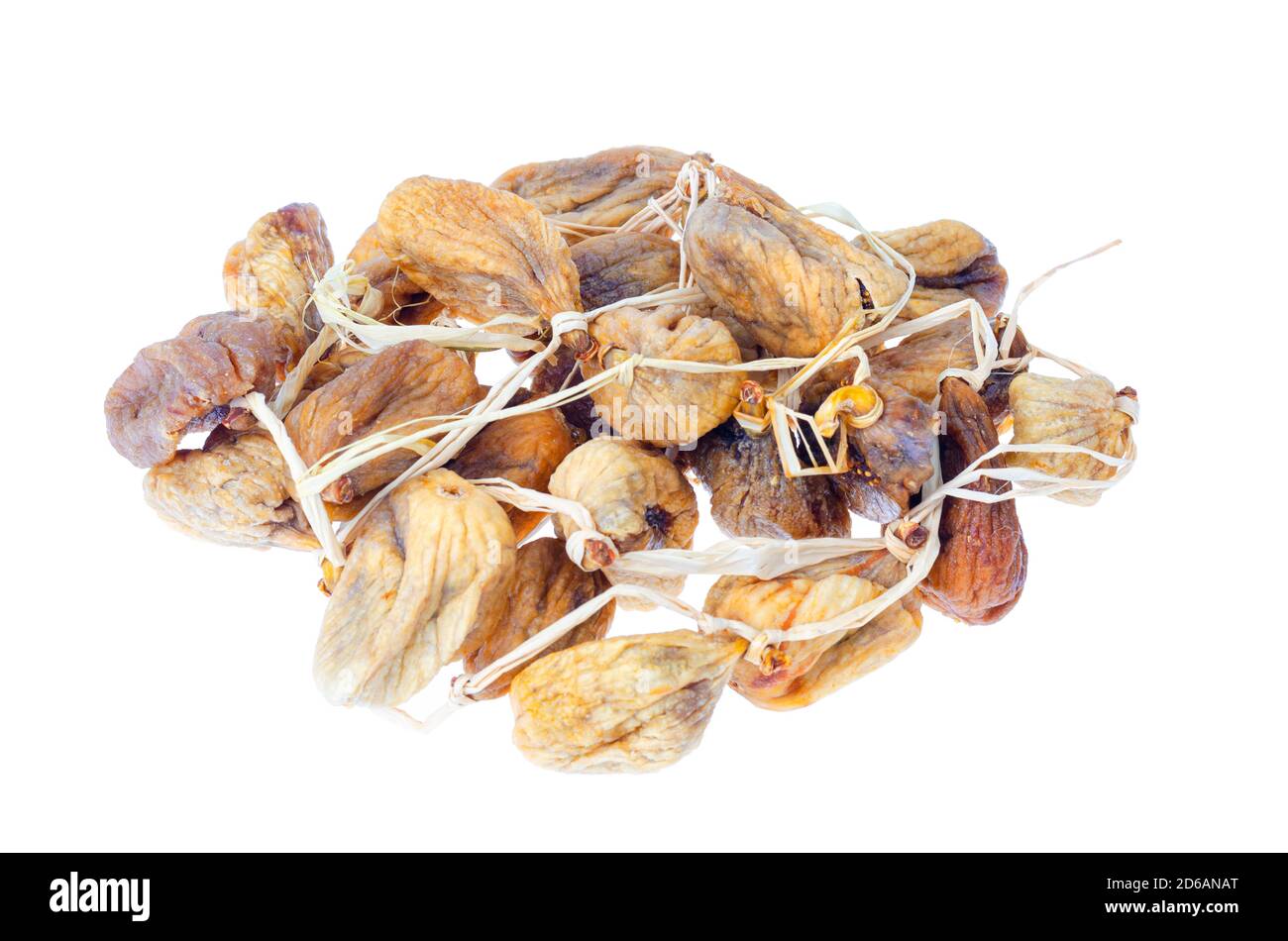 Pile of dried figs on rope isolated on white background. Studio Photo