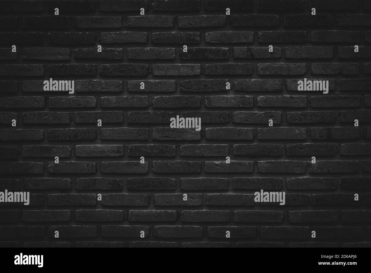 Black brick walls that are not plastered background and texture. The