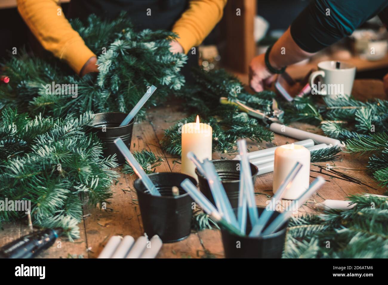 burning candle, glue, scissors and green twigs components in human ...