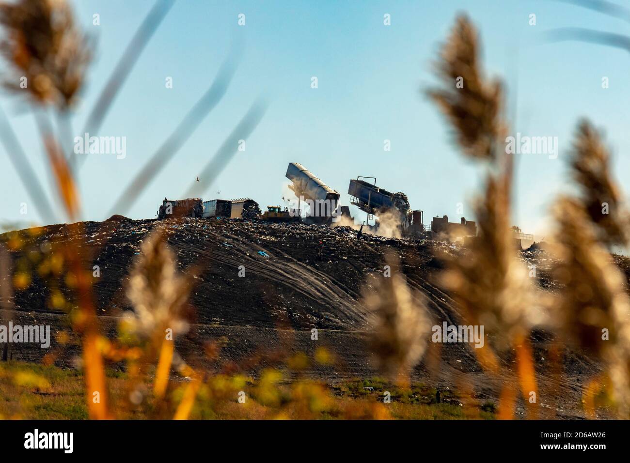 Waltz, Michigan - Trucks dump trash at Republic Services' Carleton Farms Landfill near Detroit. Stock Photo
