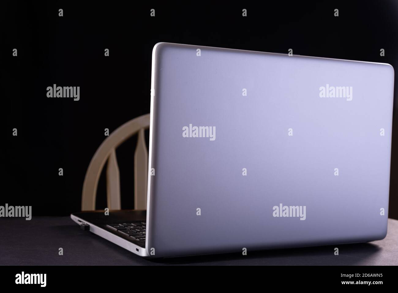 Modern laptop on table on black background Stock Photo
