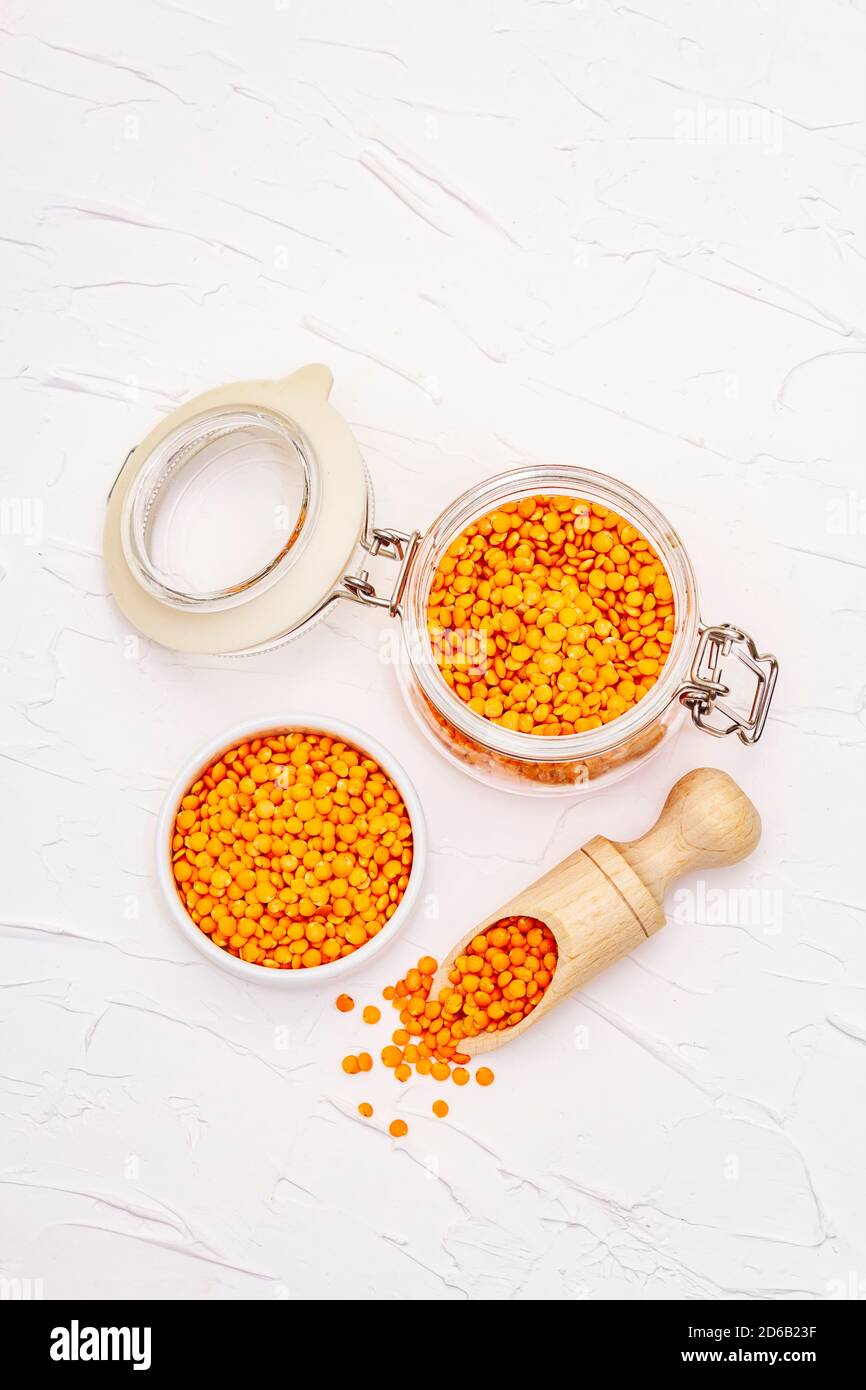 Dry orange lentils in glass jar. A valuable source of protein for a ...