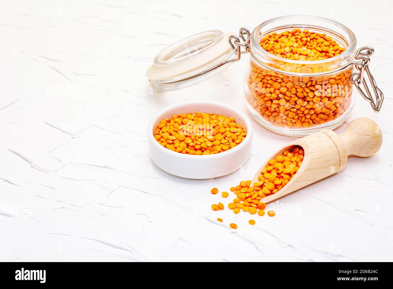 Dry orange lentils in glass jar. A valuable source of protein for a ...
