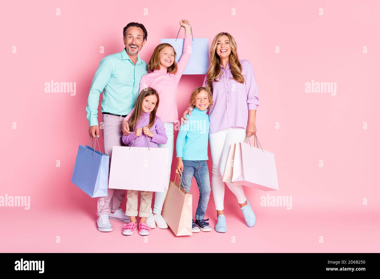 Everyone go shopping center incredible family sales. Full length photo mom mommy daddy dad enjoy spend time together buy purchase hold bags isolated Stock Photo