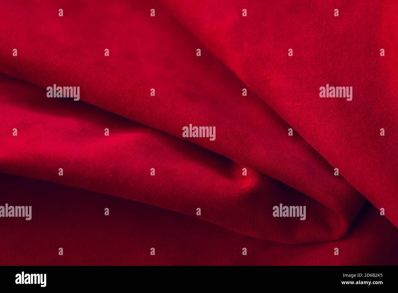 Red Suede Pattern Red matte background of suede fabric, closeup. Velvet texture of ...