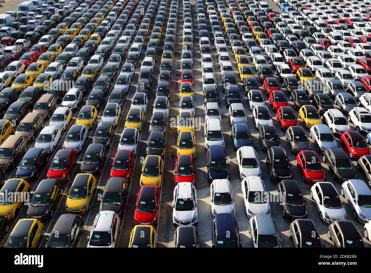 Large parking lot of new cars waiting for delivery and export, at