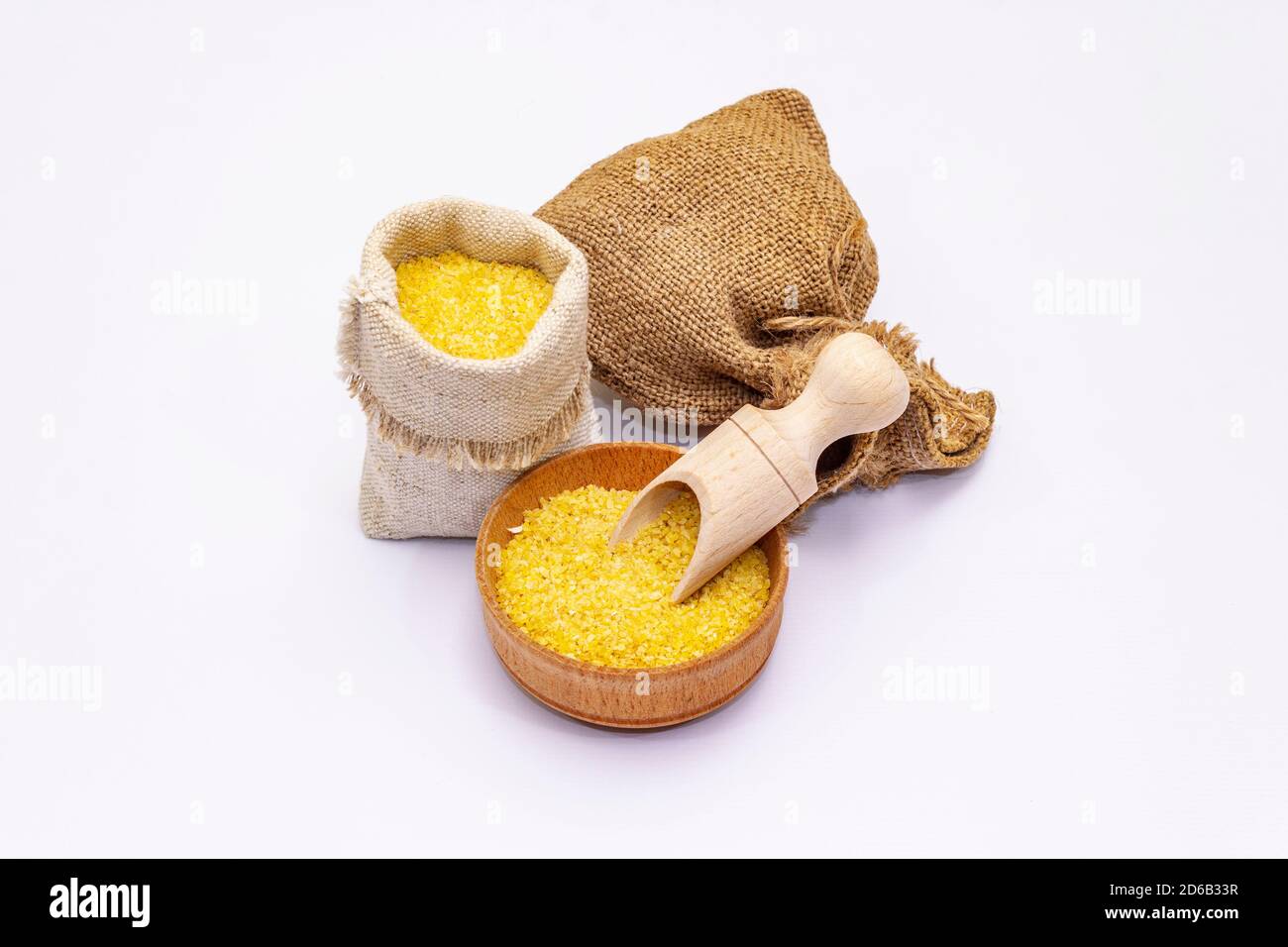 Dry corn grits isolated on white background. A traditional ingredient