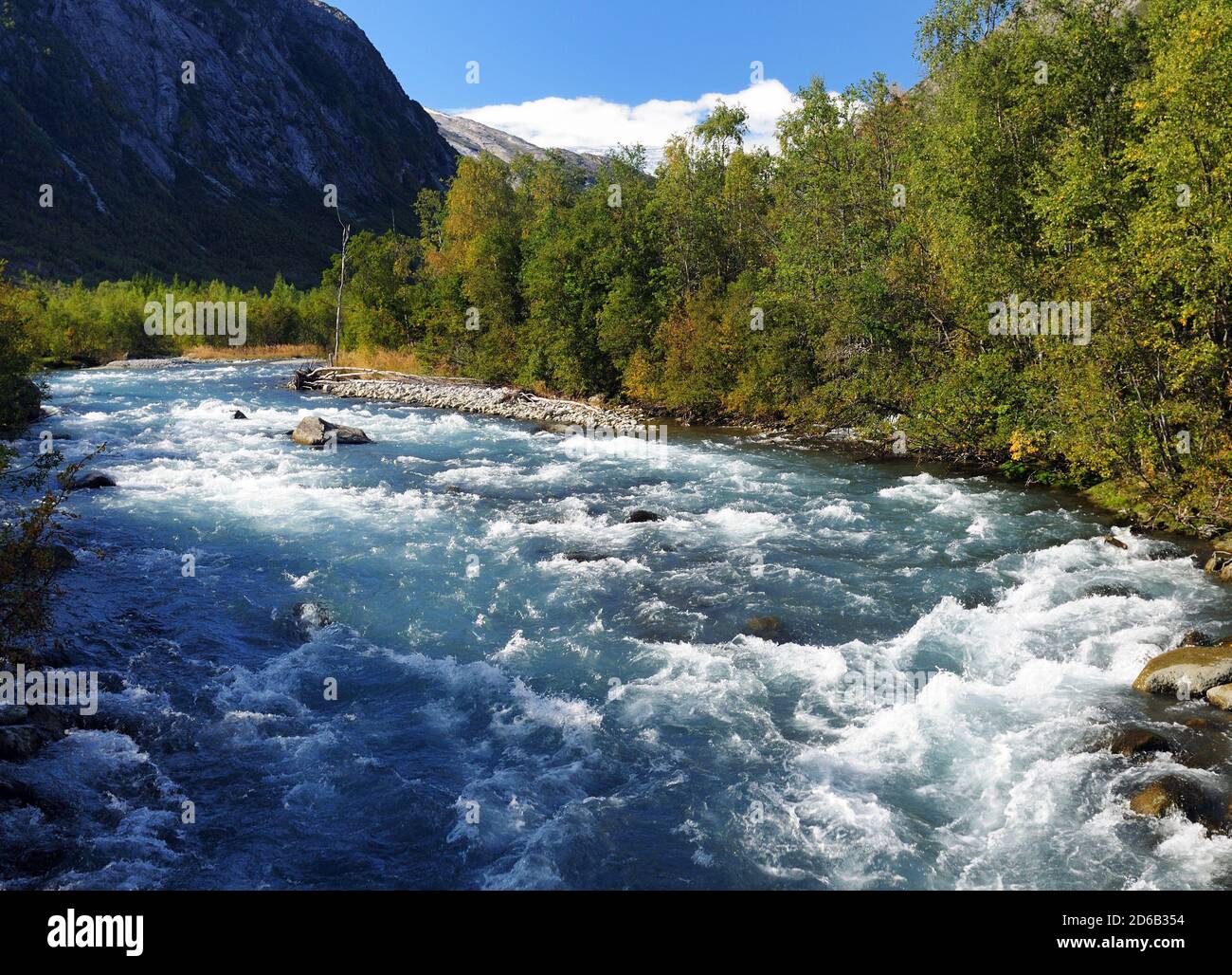 Beautiful Wild River Jostedola In Jostedalsbreen National Park On A Sunny Summer Day With A Clear Blue Sky And A Few Clouds Stock Photo