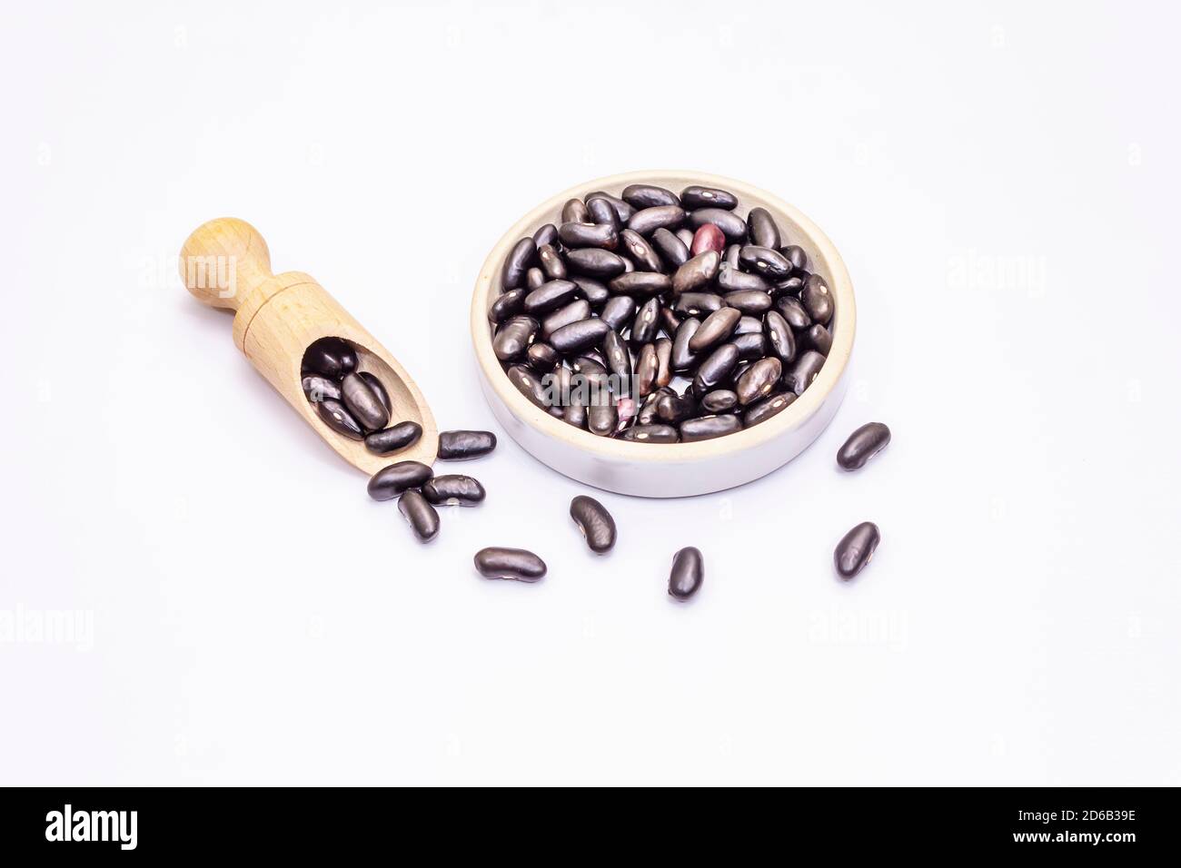 Dry black beans isolated on white background. A traditional ingredient