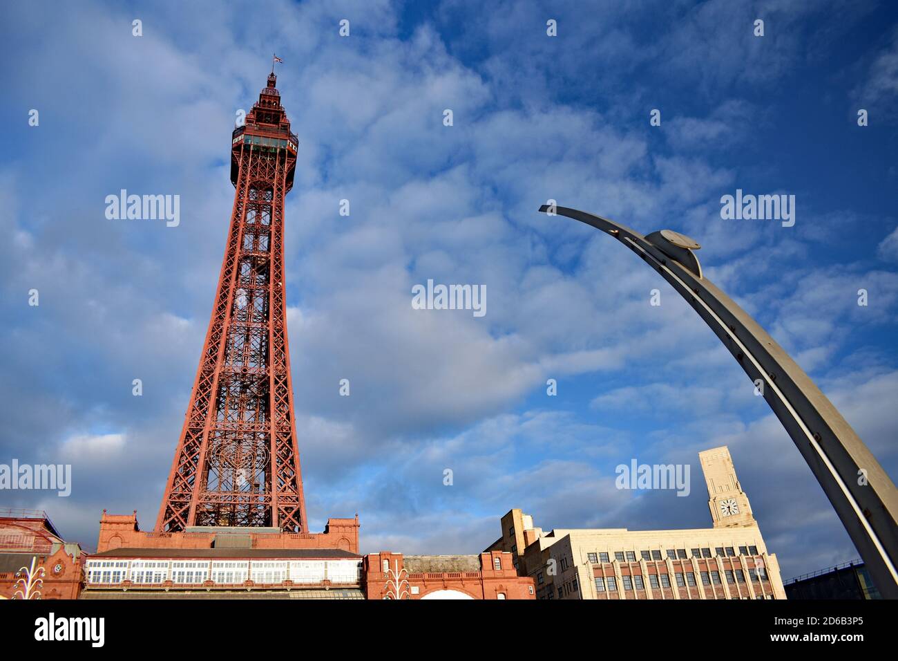 Looking upwards at the Blackpool Tower in Lancashire, North West England.  The red colour of the tower stands out against the blue sky. Stock Photo