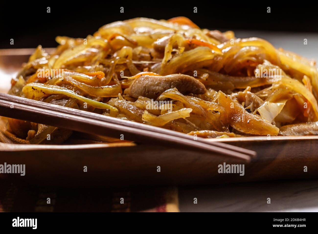 Authentic stir fried Korean chicken bokkeum with grilled carrots cabbage and onions Stock Photo