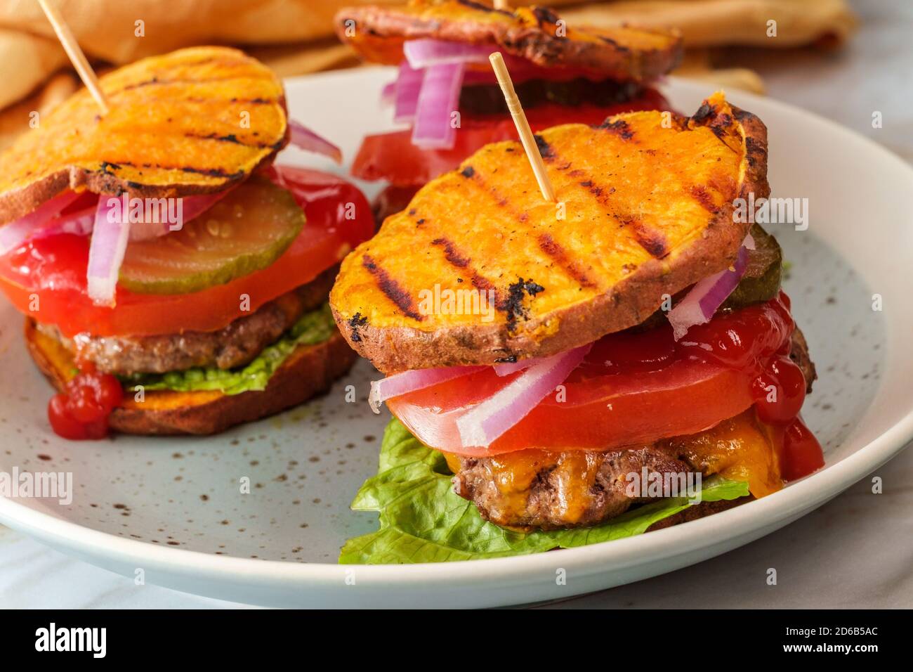 Gluten free sweet potato bun grilled cheeseburger sliders Stock Photo