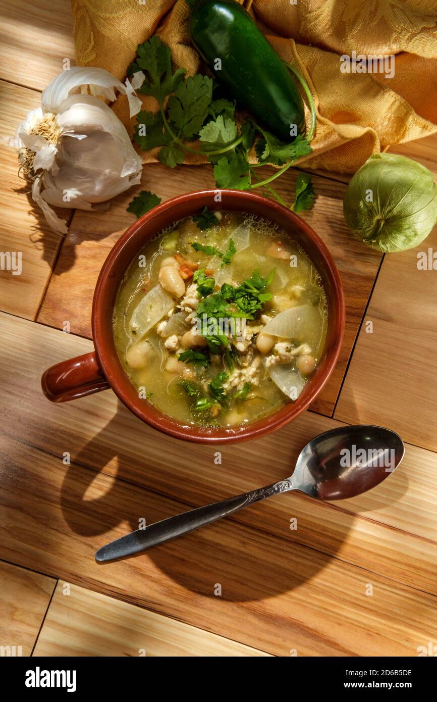 Ground pork green chili con carne with tomatillo and navy beans Stock