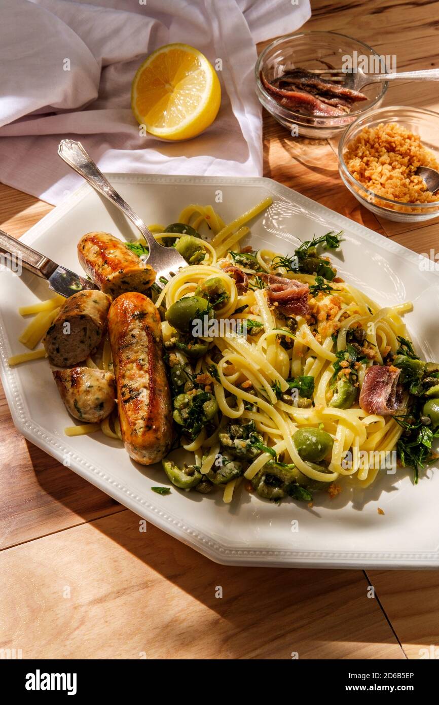 Italian chicken spinach sausage and linguine with herbed green castelvetrano olive sauce