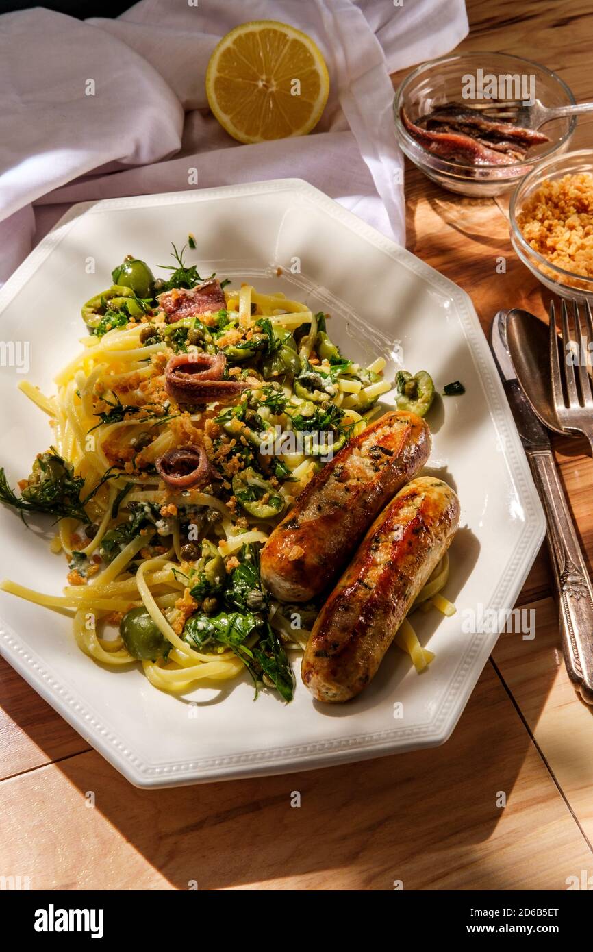 Italian chicken spinach sausage and linguine with herbed green castelvetrano olive sauce