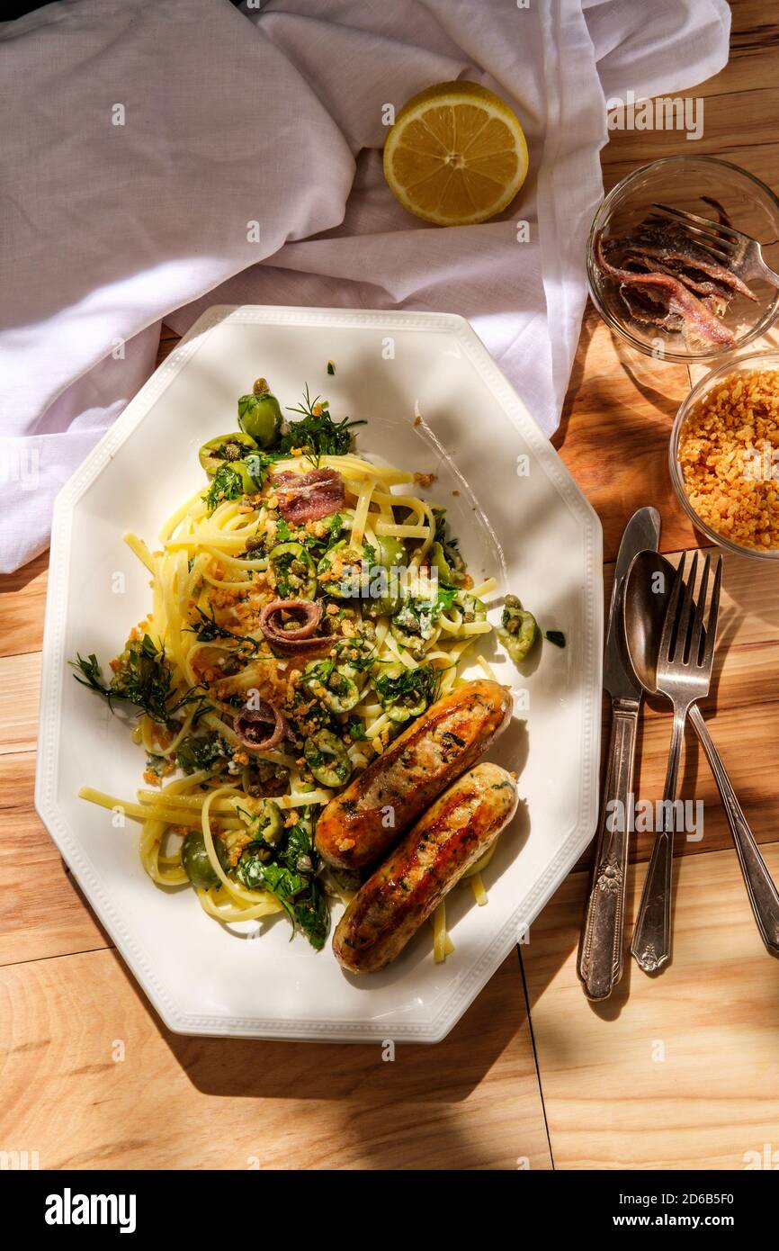 Italian chicken spinach sausage and linguine with herbed green castelvetrano olive sauce
