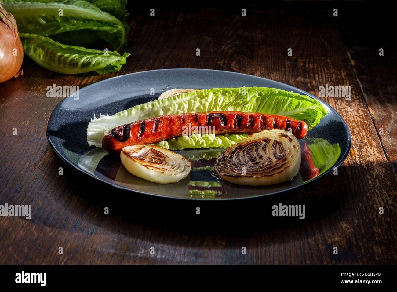 Fancy gourmet glutenfree lettuce wrap hot dog with grill marks and