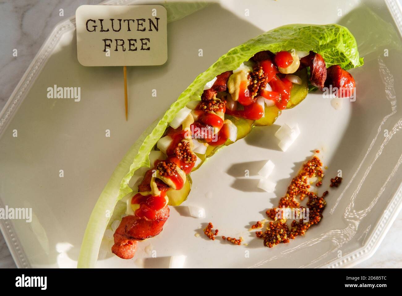 Spiralized fancy gourmet glutenfree lettuce wrap hot dog with mustard