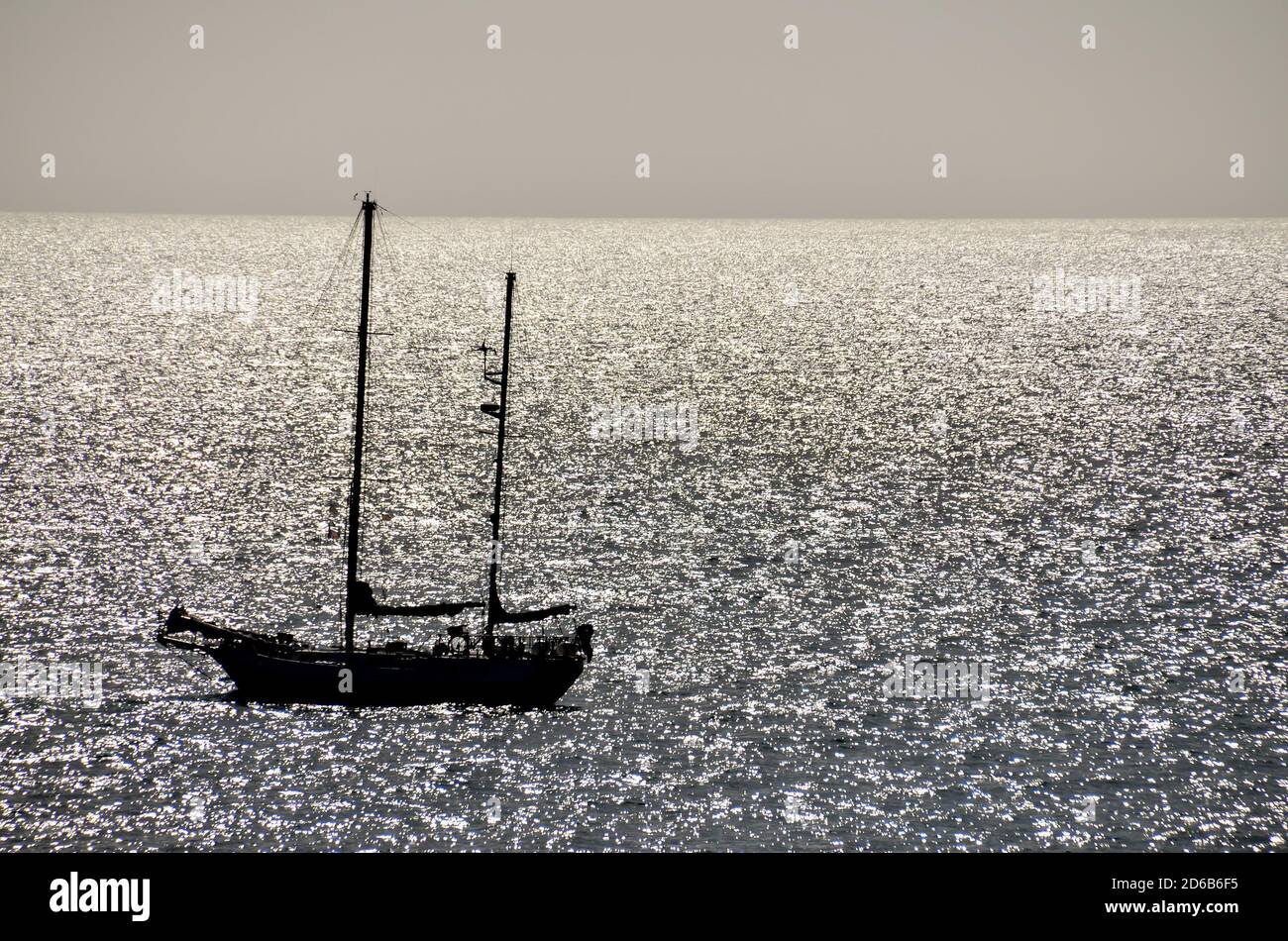 Silhouette Boat in the Ocean Stock Photo - Alamy