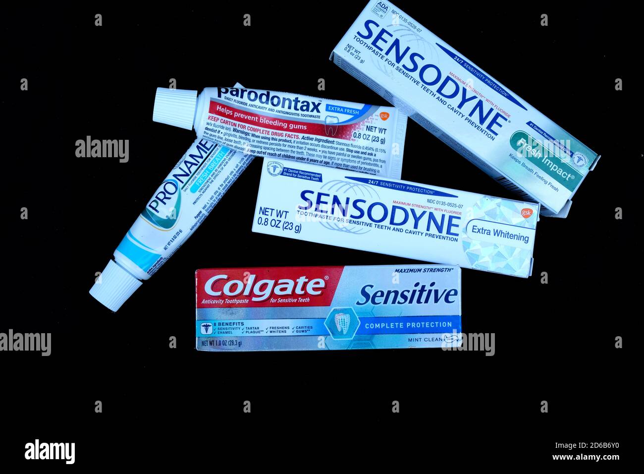 Assorted dental care toothpastes packaged as free samples given by dentist  to patients with gum disease, eroding tooth enamel, and sensitive teeth  Stock Photo - Alamy