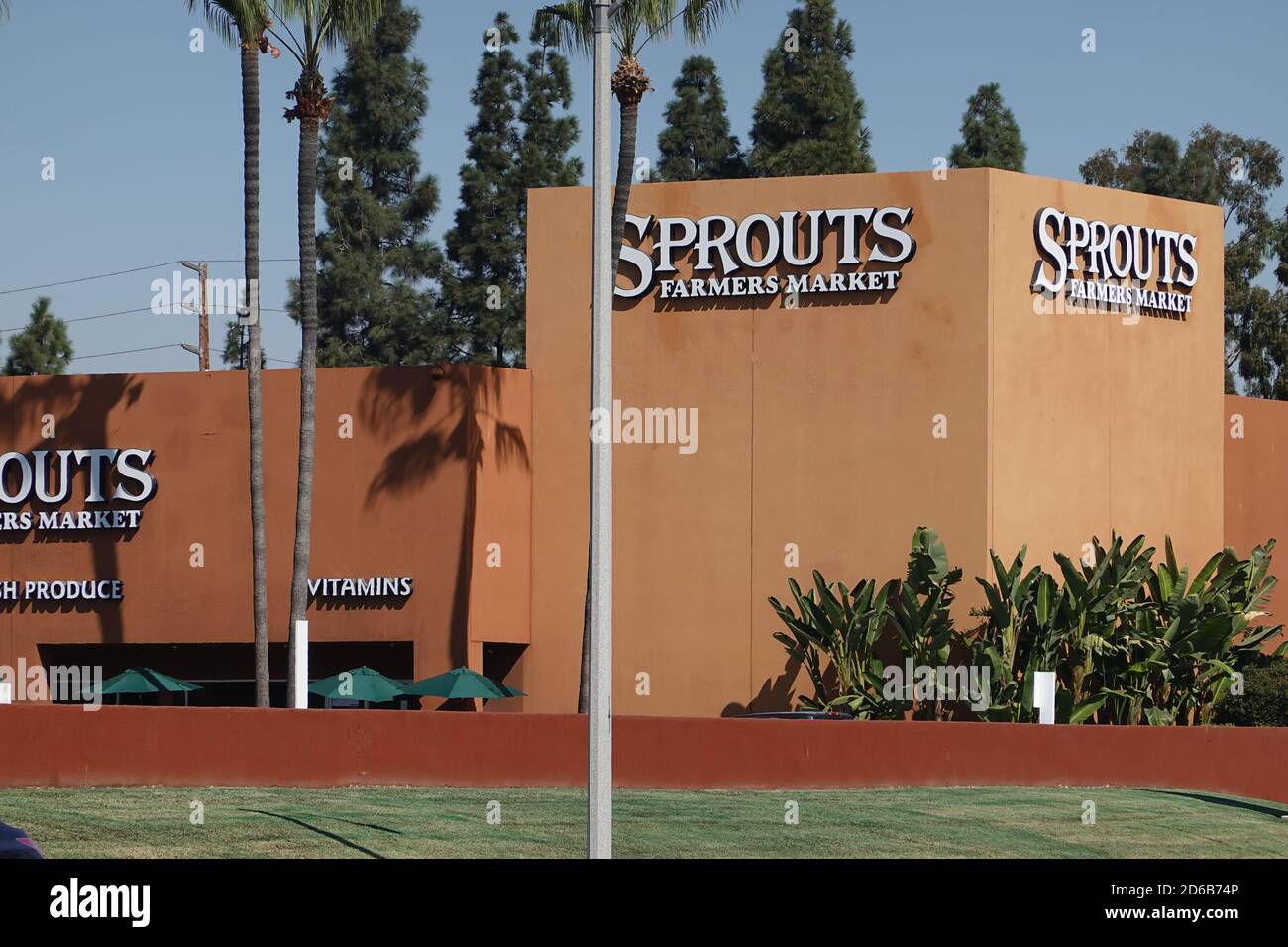 prouts neighborhood farmers market grocery store front and logo in
