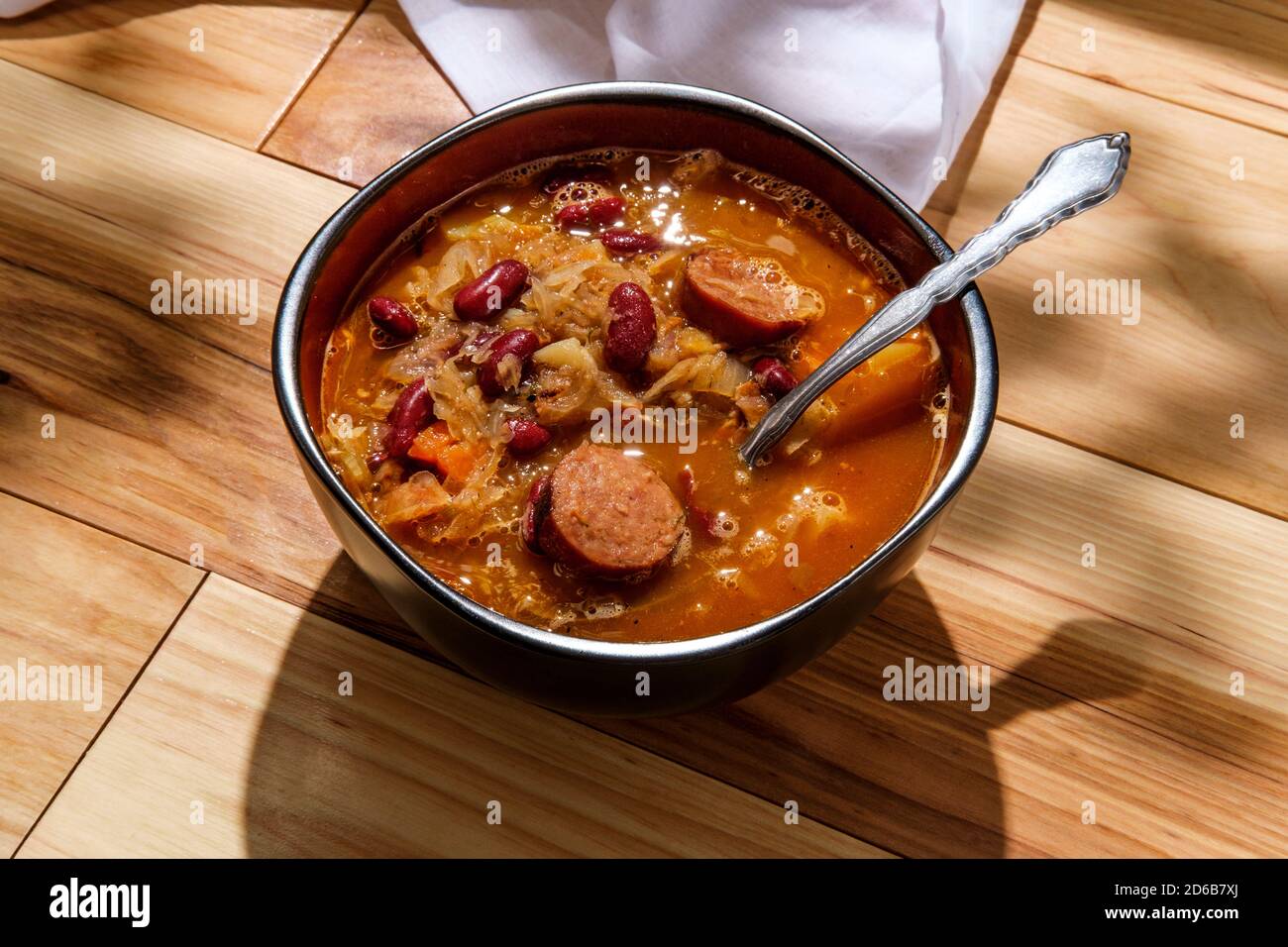 Traditional Polish sauerkraut kielbasa sausage and bean soup Stock