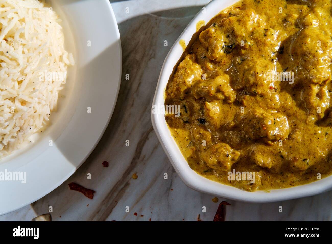 Authentic Indian almond chicken korma curry dinner with basmati rice