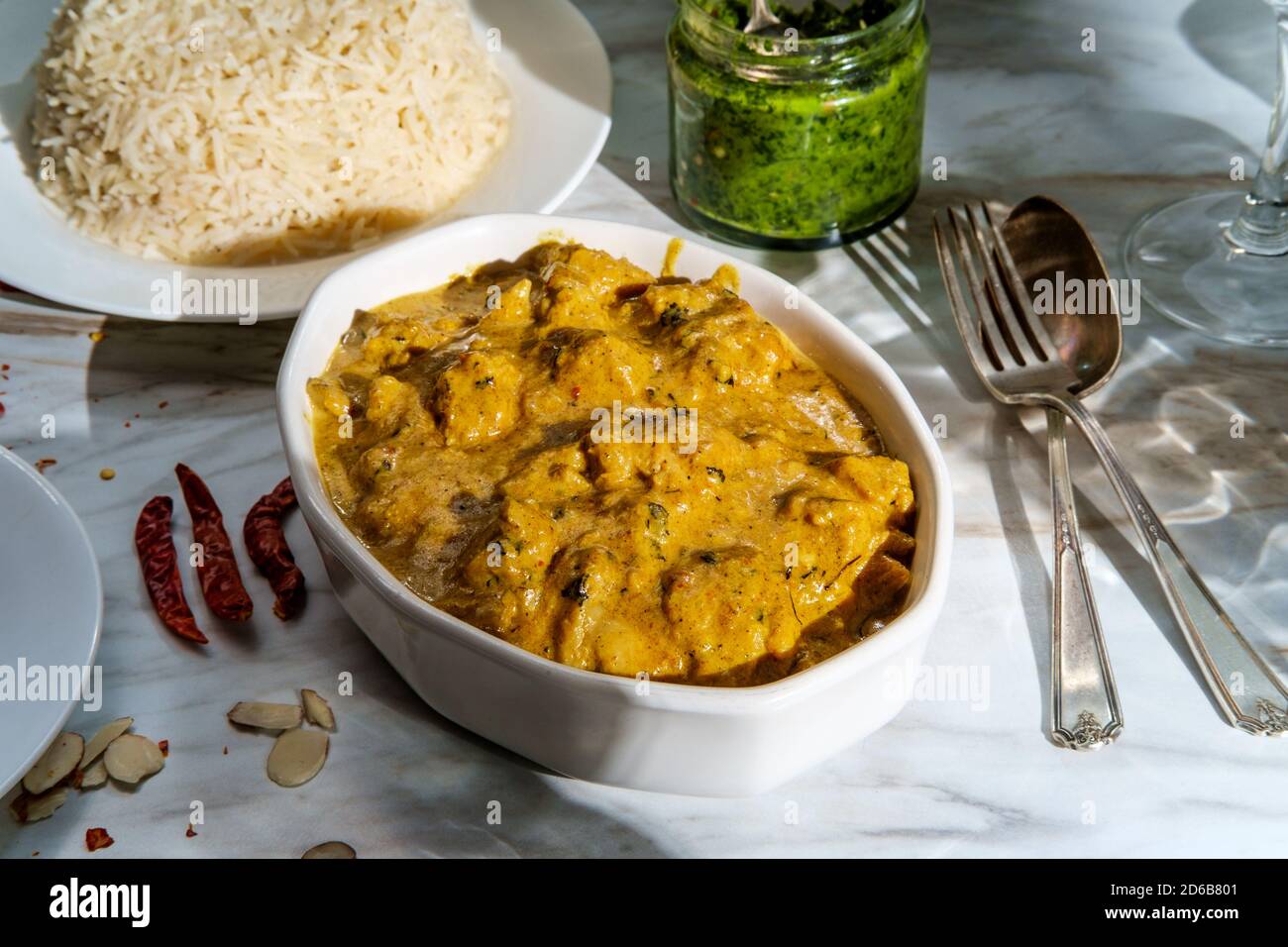 Authentic Indian almond chicken korma curry dinner with basmati rice
