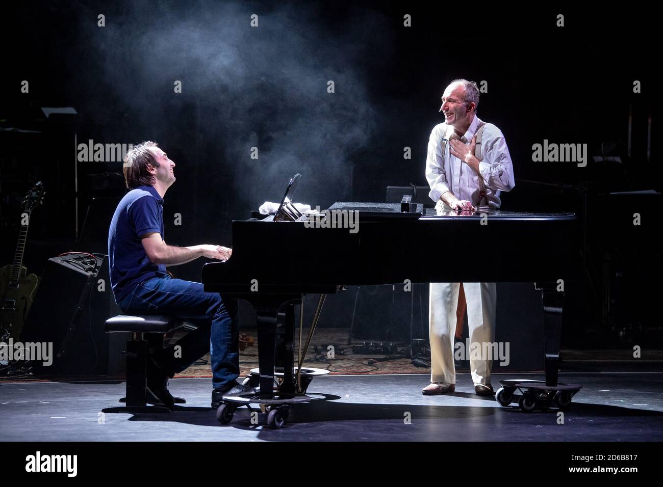 Bremen, Germany. 14th Oct, 2020. Yoel Gamzou (l), General Music Director of the Bremen Theatre, plays the piano during a rehearsal, while Martin Baum, actor, sings the song 'Imagine'. John Lennon is back on stage - the Theater Bremen sets a musical monument to the pop idol and peace activist shot by an assassin 40 years ago with the production 'Imagine'. On 17.10.2020 the premiere will take place at the Theater am Goetheplatz. Credit: Sina Schuldt/dpa/Alamy Live News Stock Photo