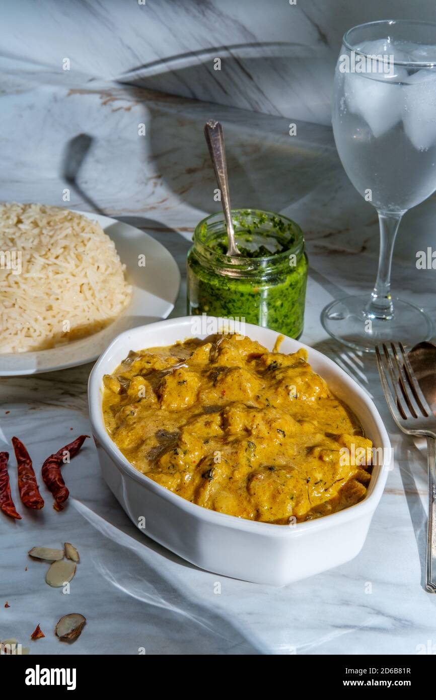 Authentic Indian almond chicken korma curry dinner with basmati rice