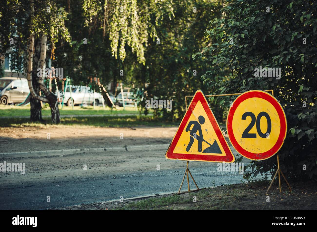 Traffic sign: 'Be careful, road works are being carried out.' Speed: 20 km / h. Stock Photo