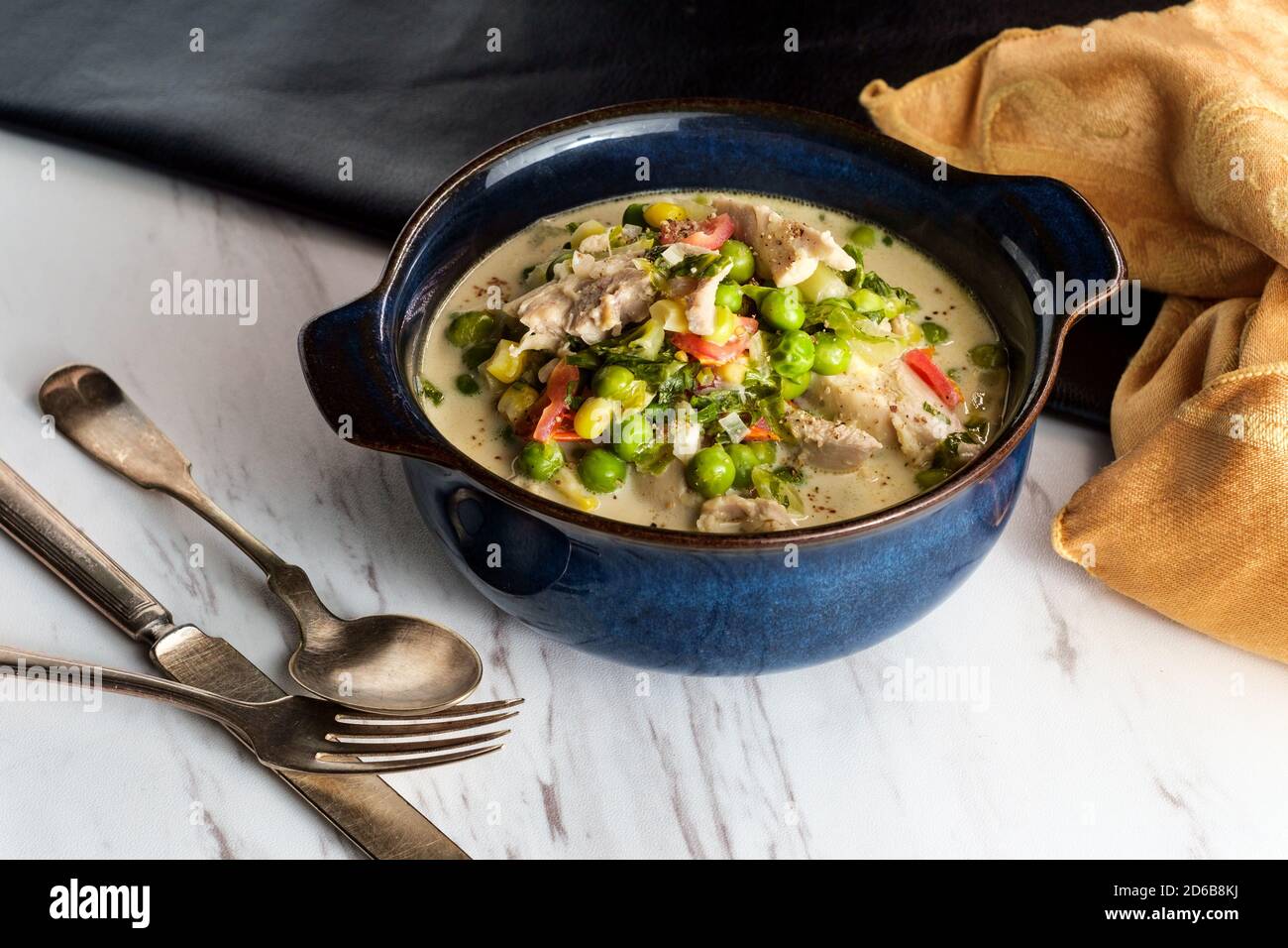British slow cooked chicken thigh fricassee stew in white sauce with