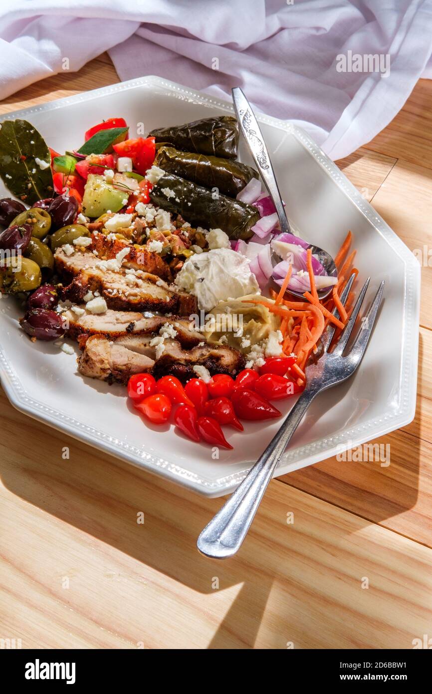 Greek olive hummus platter with chicken shawarma and sweety drop
