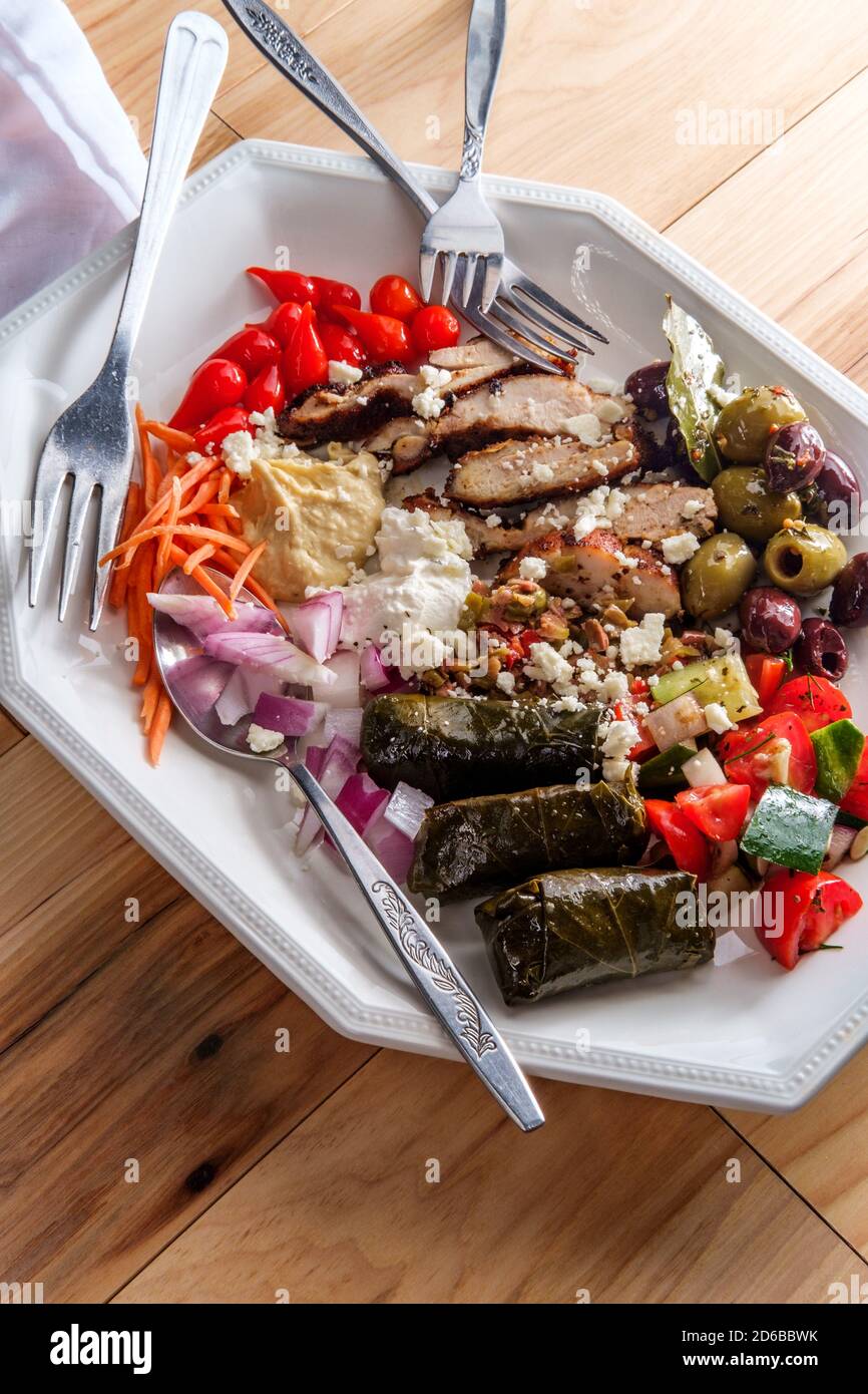 Greek olive hummus platter with chicken shawarma and sweety drop
