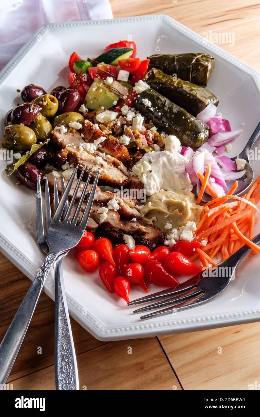 Greek olive hummus platter with chicken shawarma and sweety drop