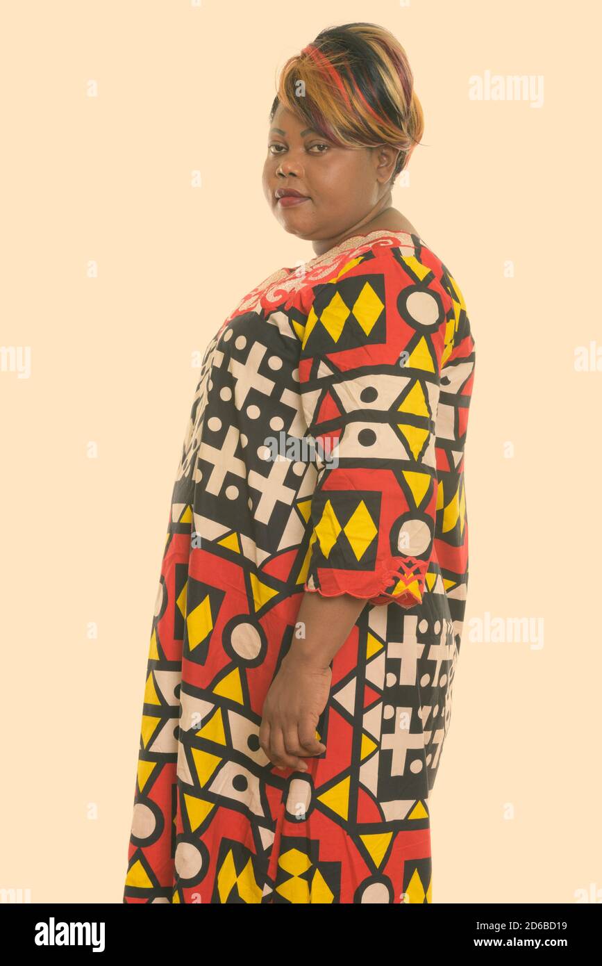 Studio shot of fat black African woman standing Stock Photo - Alamy