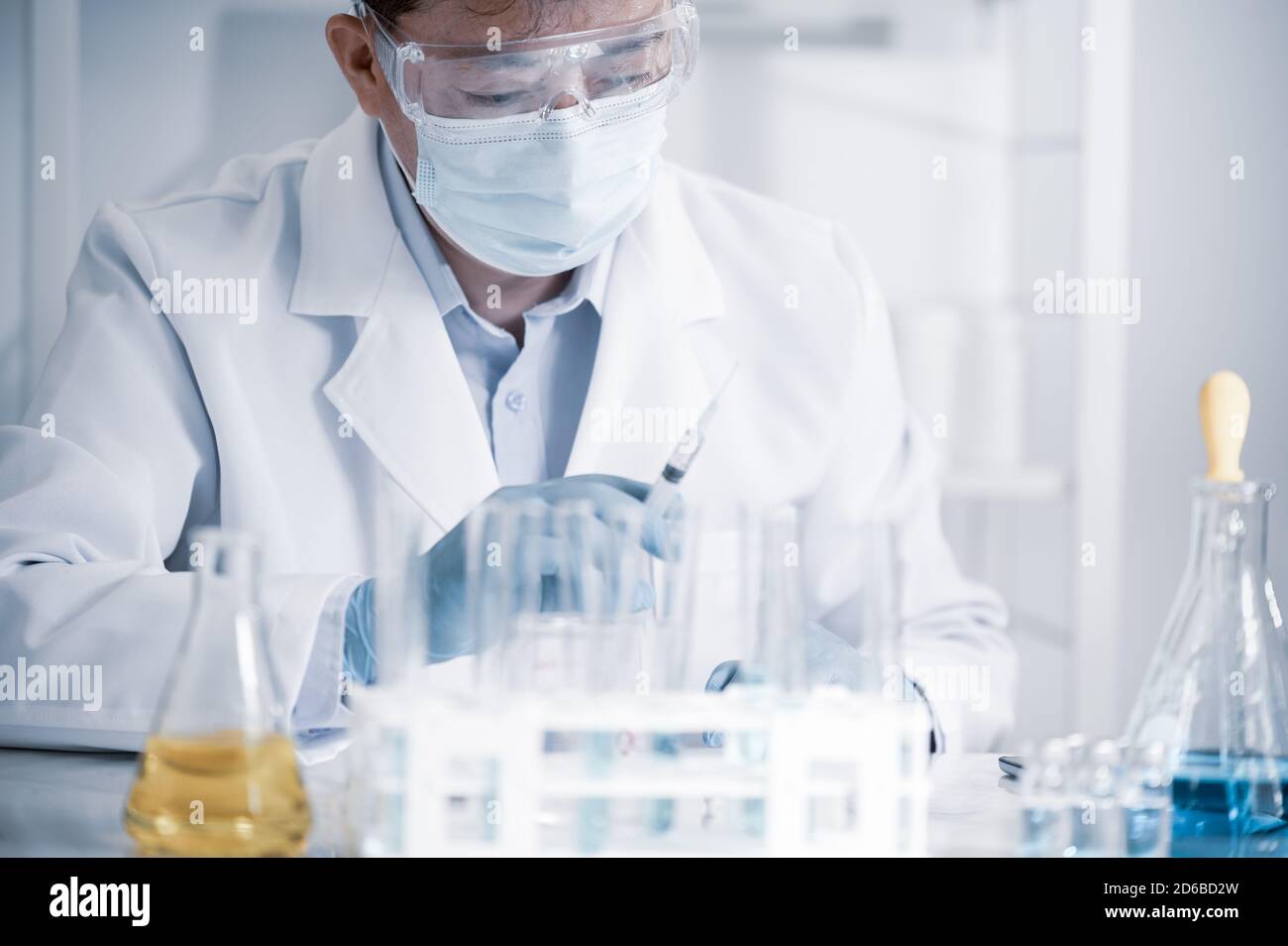 Asian male scientist working in a laboratory. Vaccine development concept. Stock Photo