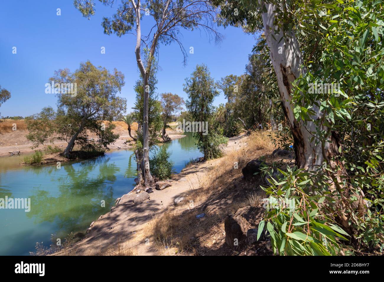Yardenit stream in northern Israel, water flowing near eucalyptus trees from the Sea of Galilee Stock Photo