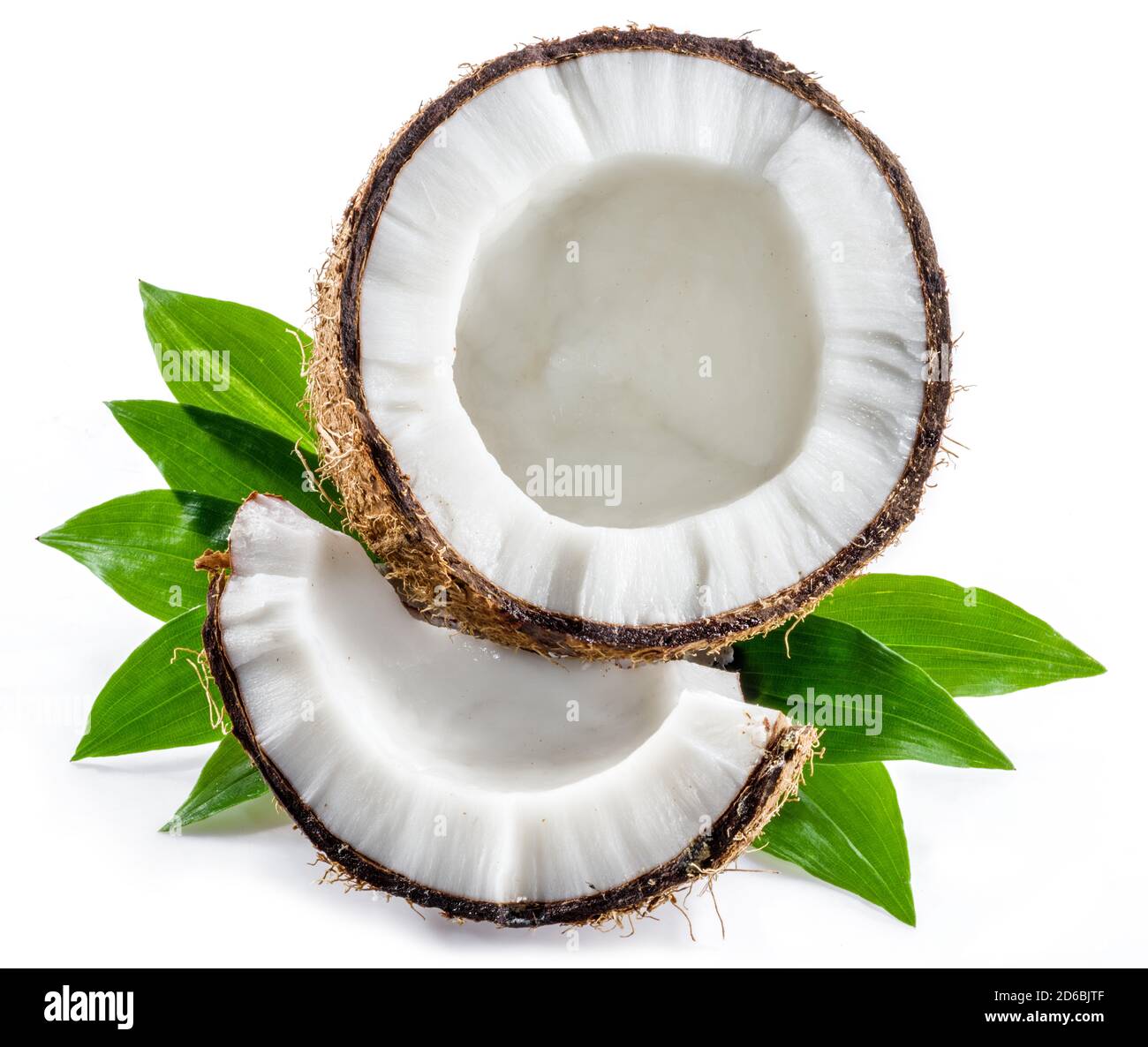 Cracked coconut fruit with white flesh and a piece of coconut isolated on white background. Stock Photo