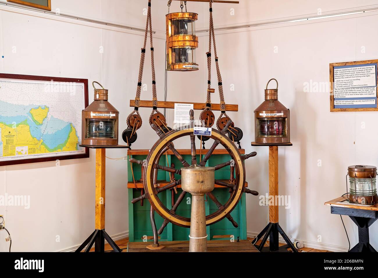 Townsville, Queensland, Australia - June 2020: Lighting objects and steering wheel used in navigation in a bygone era Stock Photo