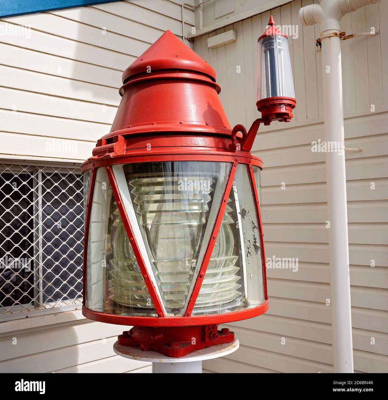 Townsville, Queensland, Australia - June 2020: Red maritime lantern warning ships of danger, now on display in a museum Stock Photo