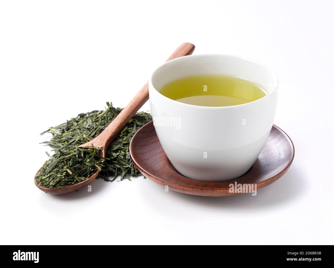 Green tea and tea leaves on a white background. Image of Japanese green