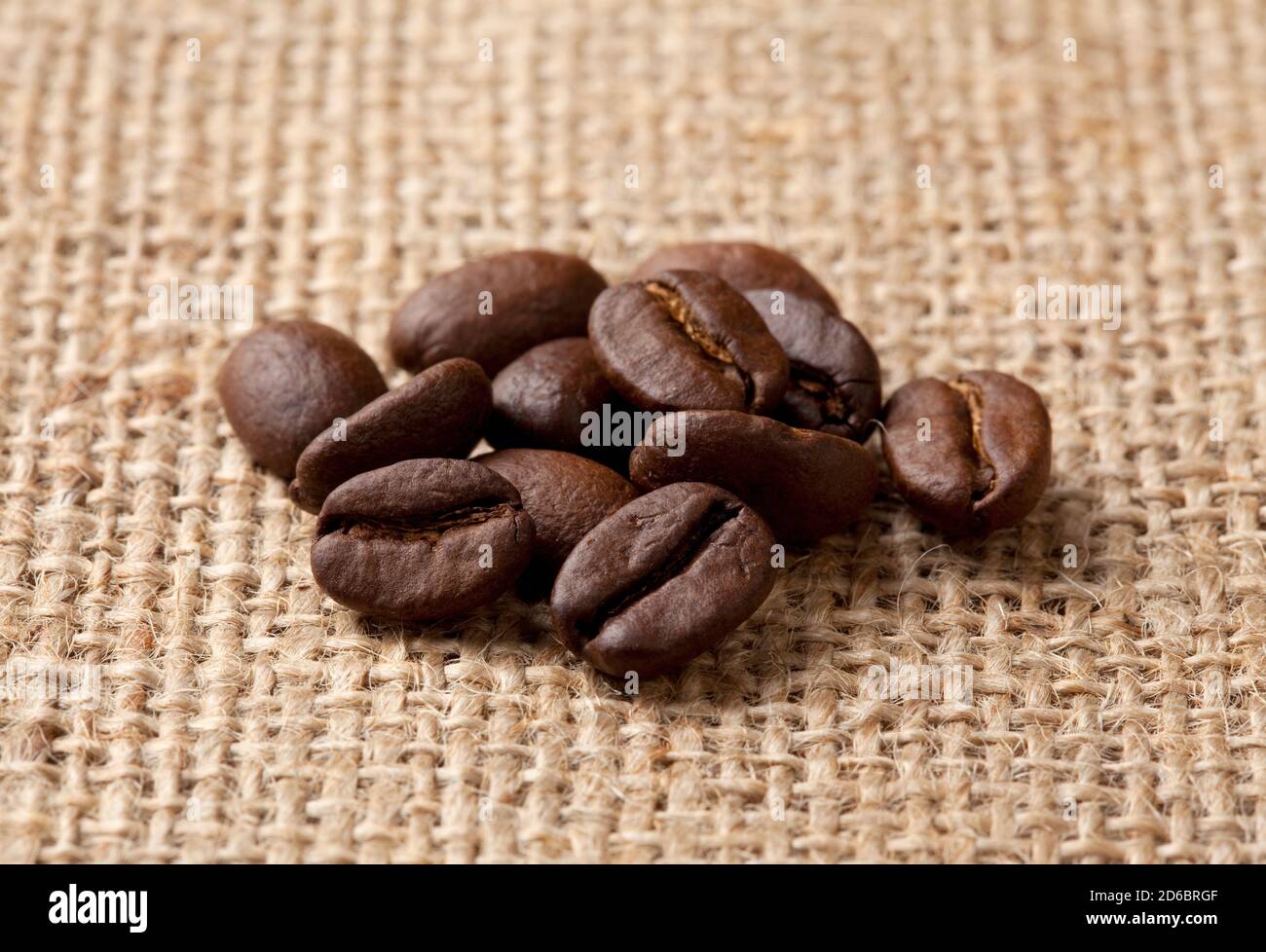 Coffee beans on a rough sacking Stock Photo