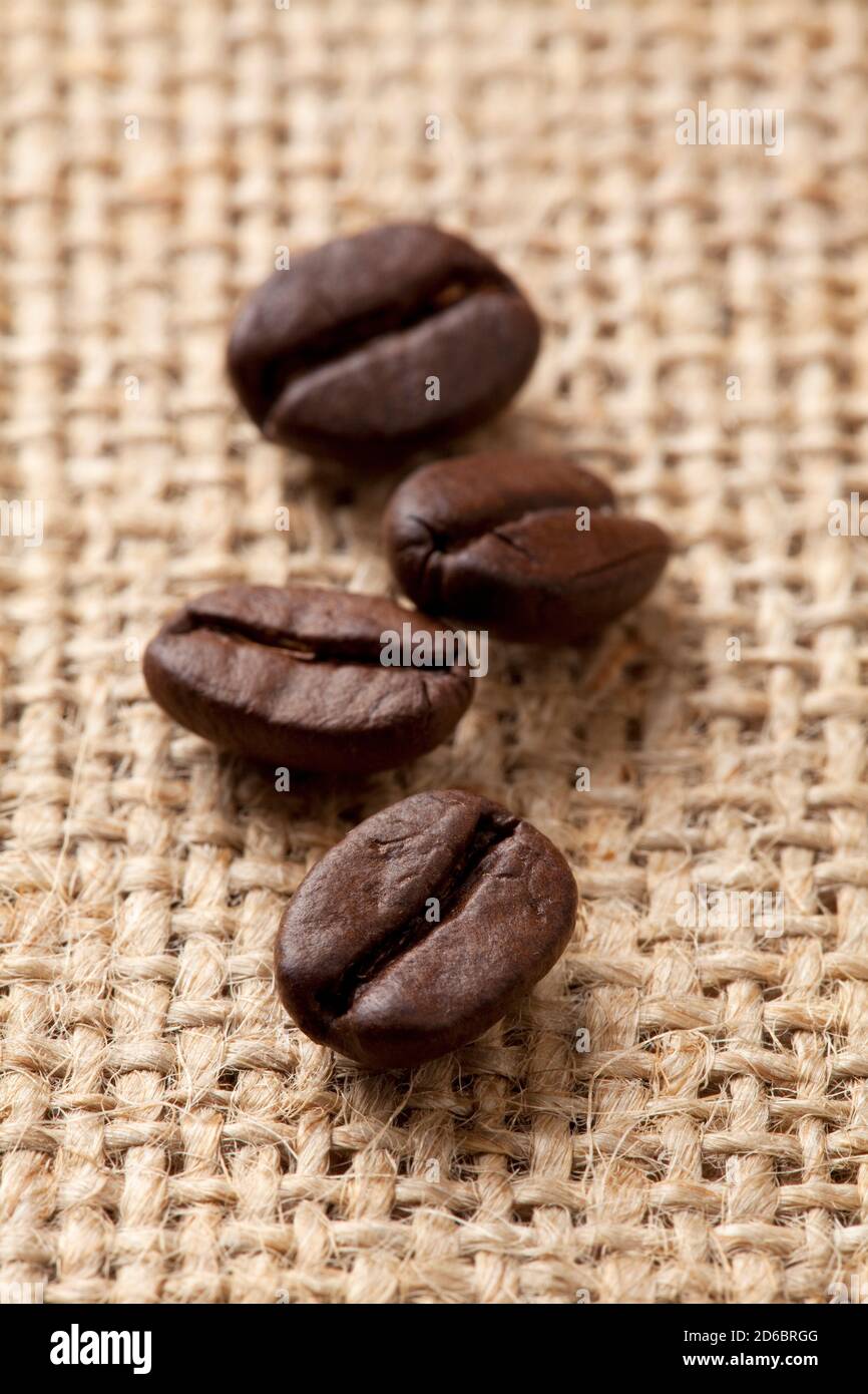Coffee beans on a rough sacking Stock Photo
