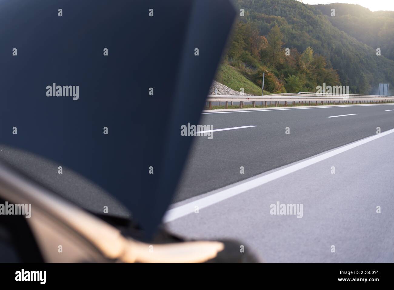 Car emergency or breakdown on highway road, waiting for help, car stopped during highway driving. Stock Photo